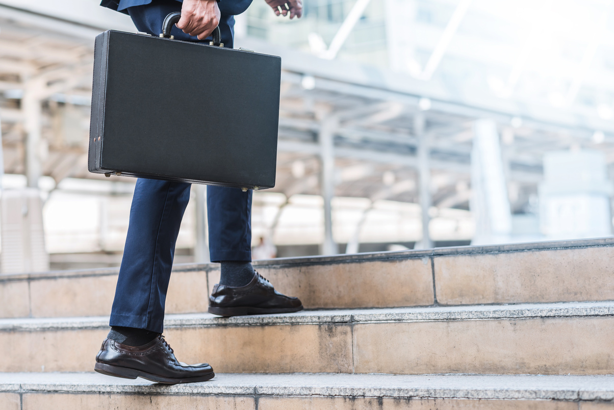 Businessman Climbing Up the Stairs 